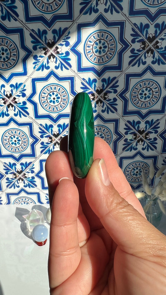 Authentic Malachite Palm Stones with wonderful patterns, High Quality and shine surface. No obvious blemishes. 2 inches 2.2 ounces