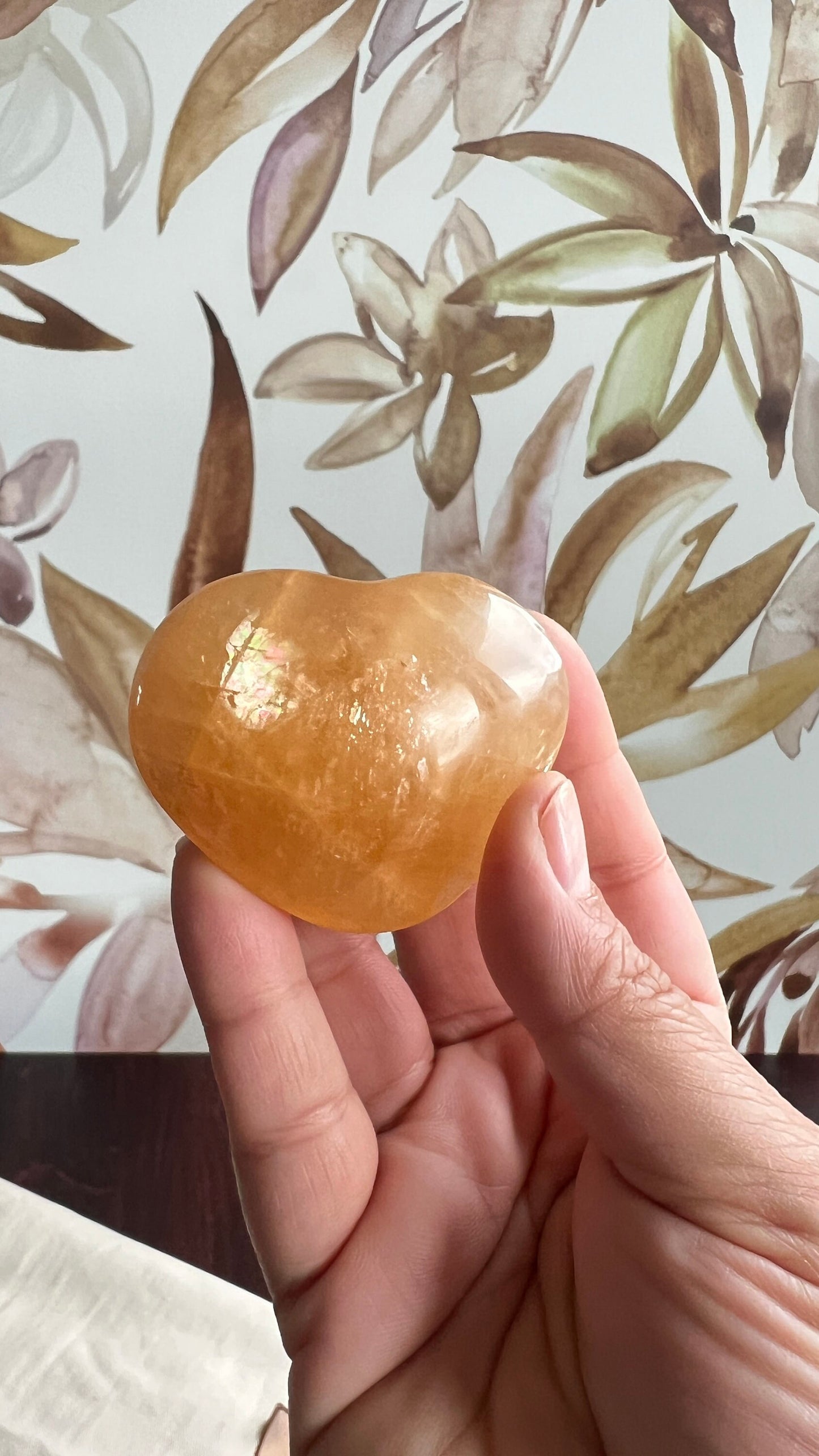 Beautiful Honey Calcite Heart Carving with rainbow inclusions 2 1/2 inches wide 3.5 ounces