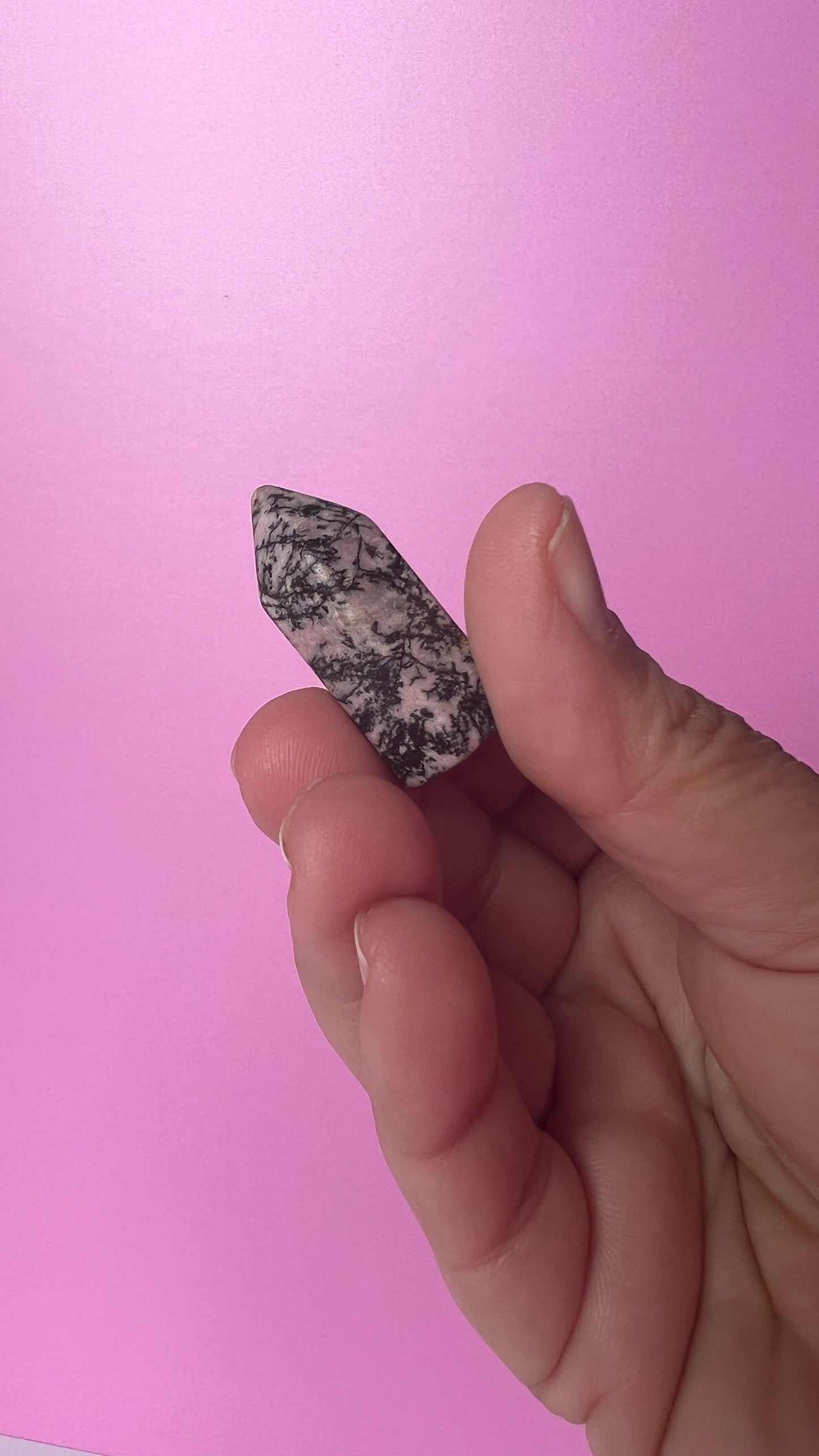 Colorful Rhodonite mini points 1 1/2 inch tall towers with a great pink color and black manganese throughout, Small and subtle crystals.