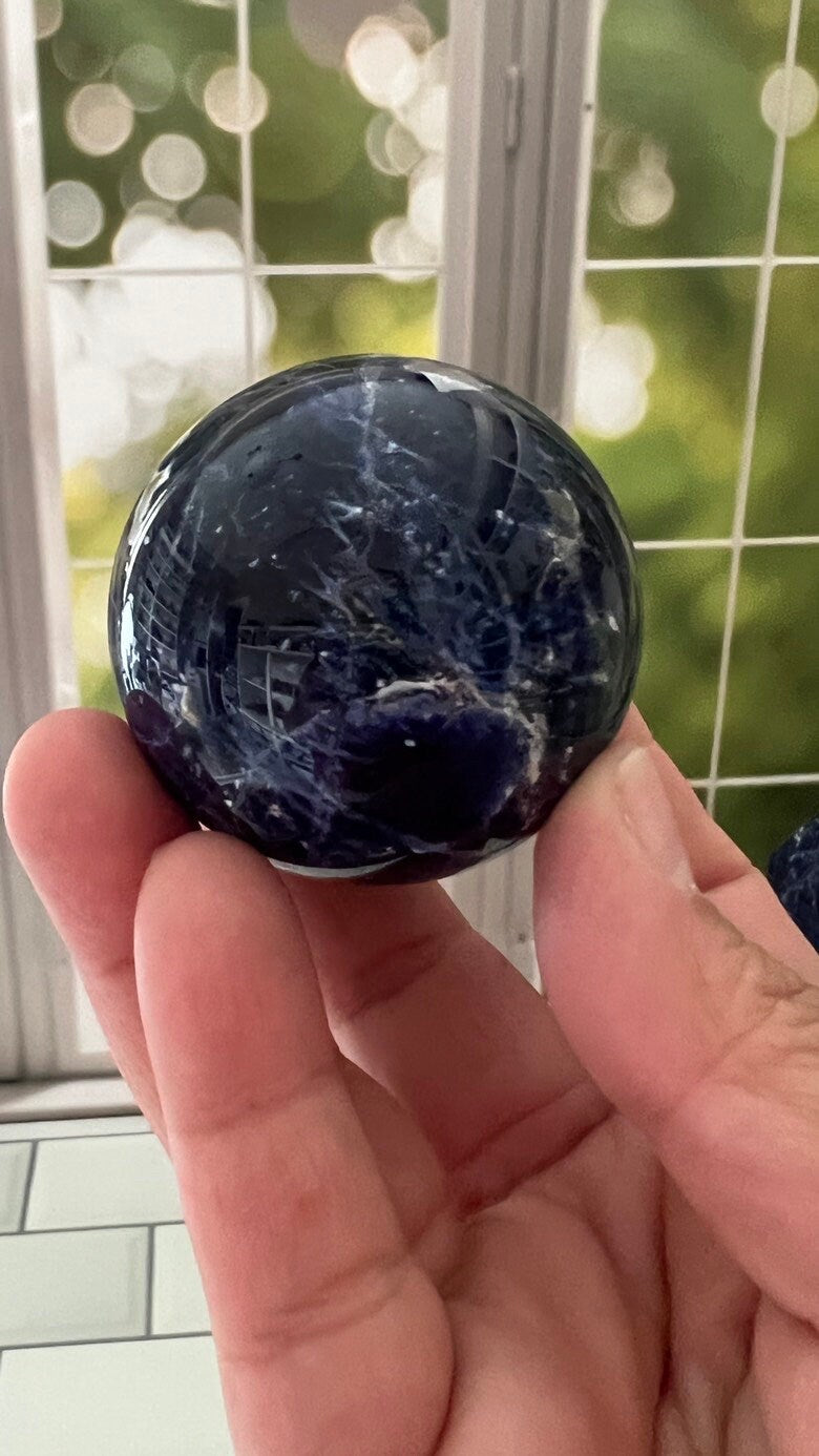 Stunning 2 inch Sodalite Sphere with deep royal blue color with a white calcite pattern, wooden stand included.