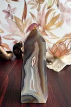 Load image into Gallery viewer, Gorgeous Agate Tower, with swirling colors throughout stands 7 1/2 inches and weighs 2.5 pounds (AG-T-1)
