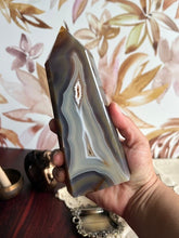 Load image into Gallery viewer, Gorgeous Agate Tower, with swirling colors throughout stands 7 1/2 inches and weighs 2.5 pounds (AG-T-1)
