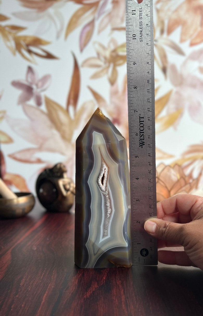 Gorgeous Agate Tower, with swirling colors throughout stands 7 1/2 inches and weighs 2.5 pounds (AG-T-1)