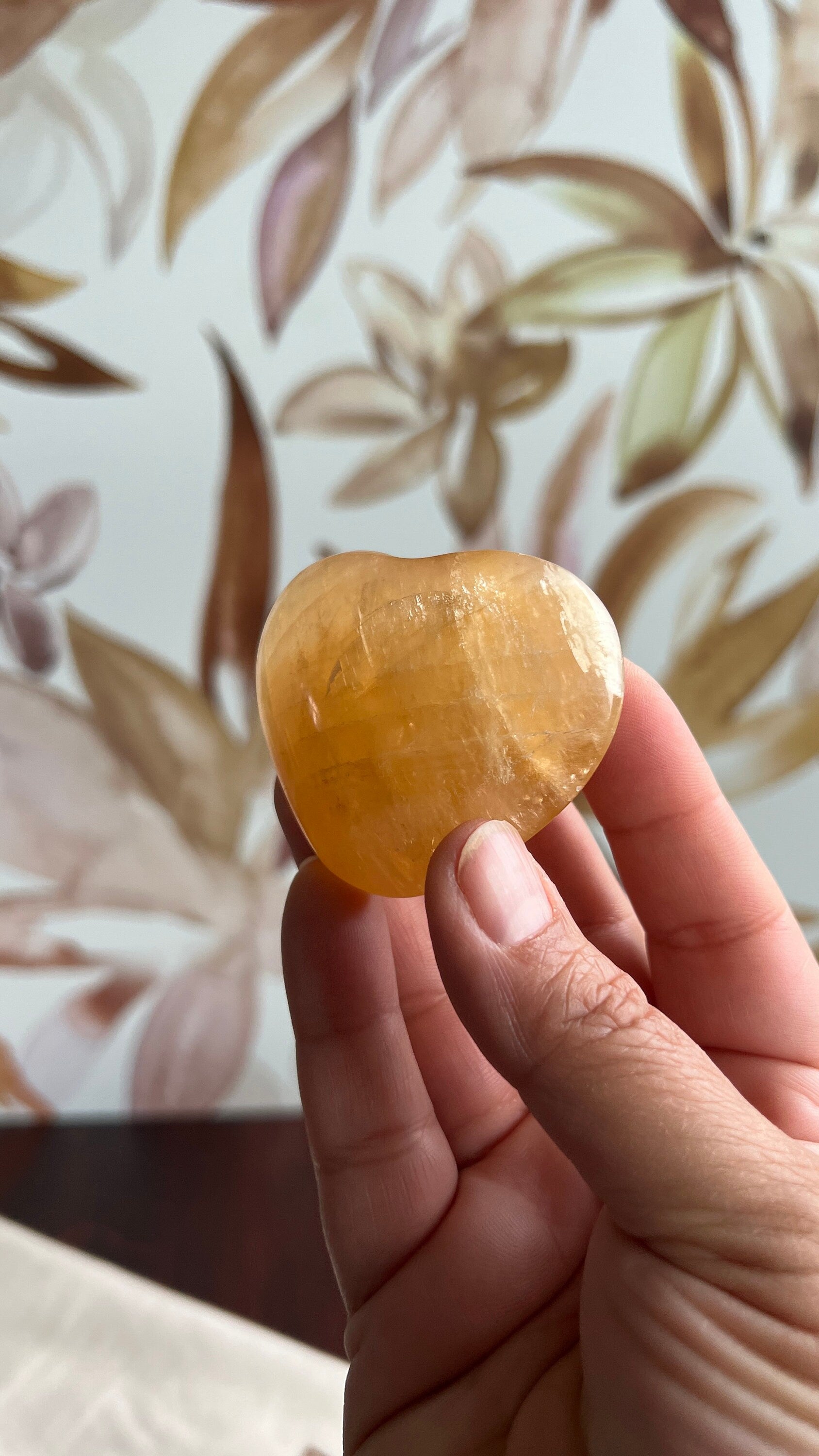 Beautiful Honey Calcite Heart Carving with rainbow inclusions 2 1/2 inches wide 3.5 ounces