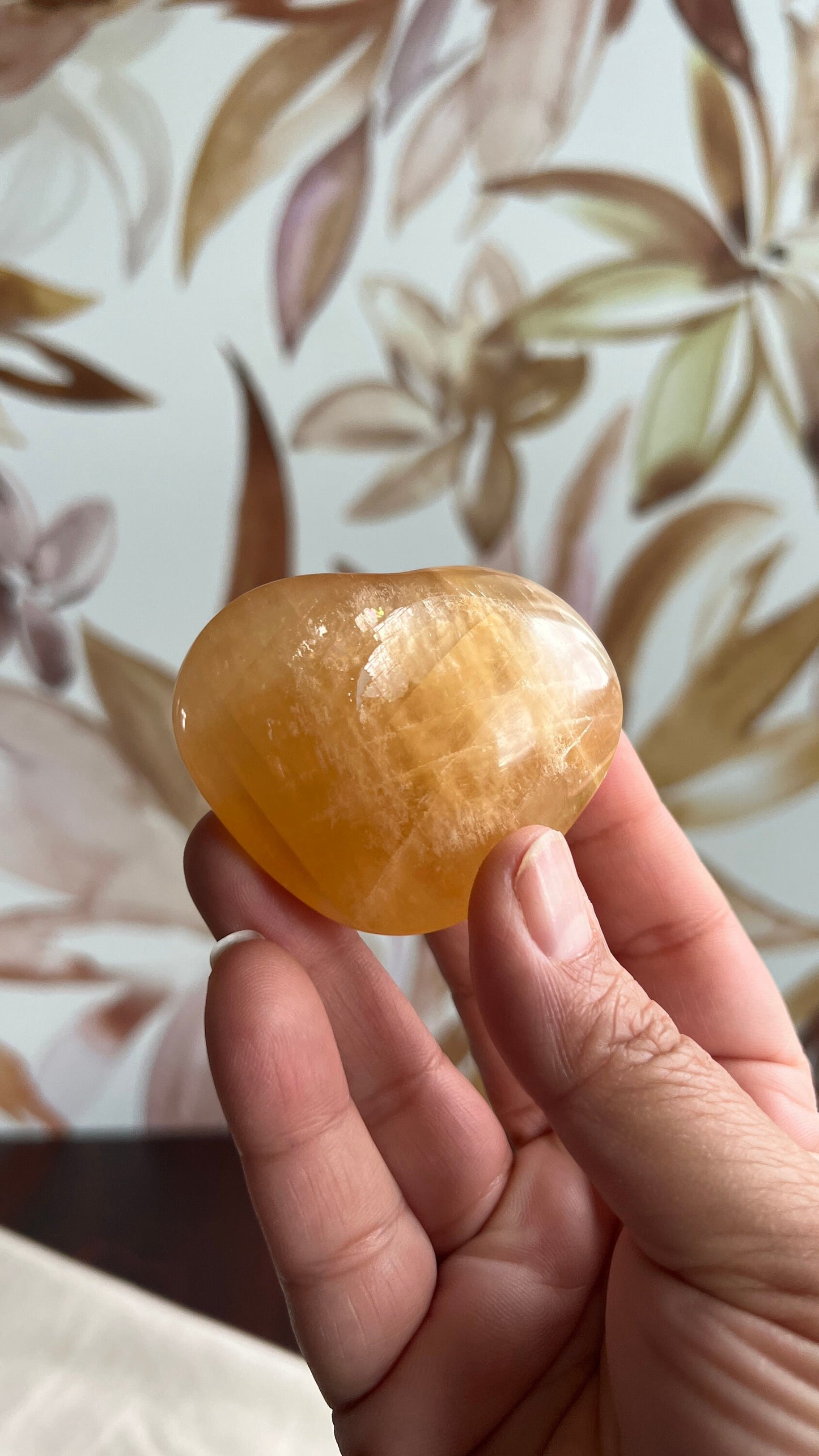 Beautiful Honey Calcite Heart Carving with rainbow inclusions 2 1/2 inches wide 3.5 ounces