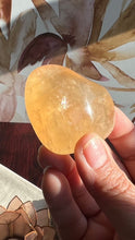 Load image into Gallery viewer, Beautiful Honey Calcite Heart Carving with rainbow inclusions 2 1/4 inches wide 2.8 ounces (HC-Heart2)
