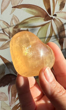 Load image into Gallery viewer, Beautiful Honey Calcite Heart Carving with rainbow inclusions 2 1/4 inches wide 2.8 ounces (HC-Heart2)
