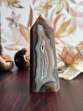 Load image into Gallery viewer, Gorgeous Agate Tower, with swirling colors throughout stands 7 1/2 inches and weighs 2.5 pounds (AG-T-1)
