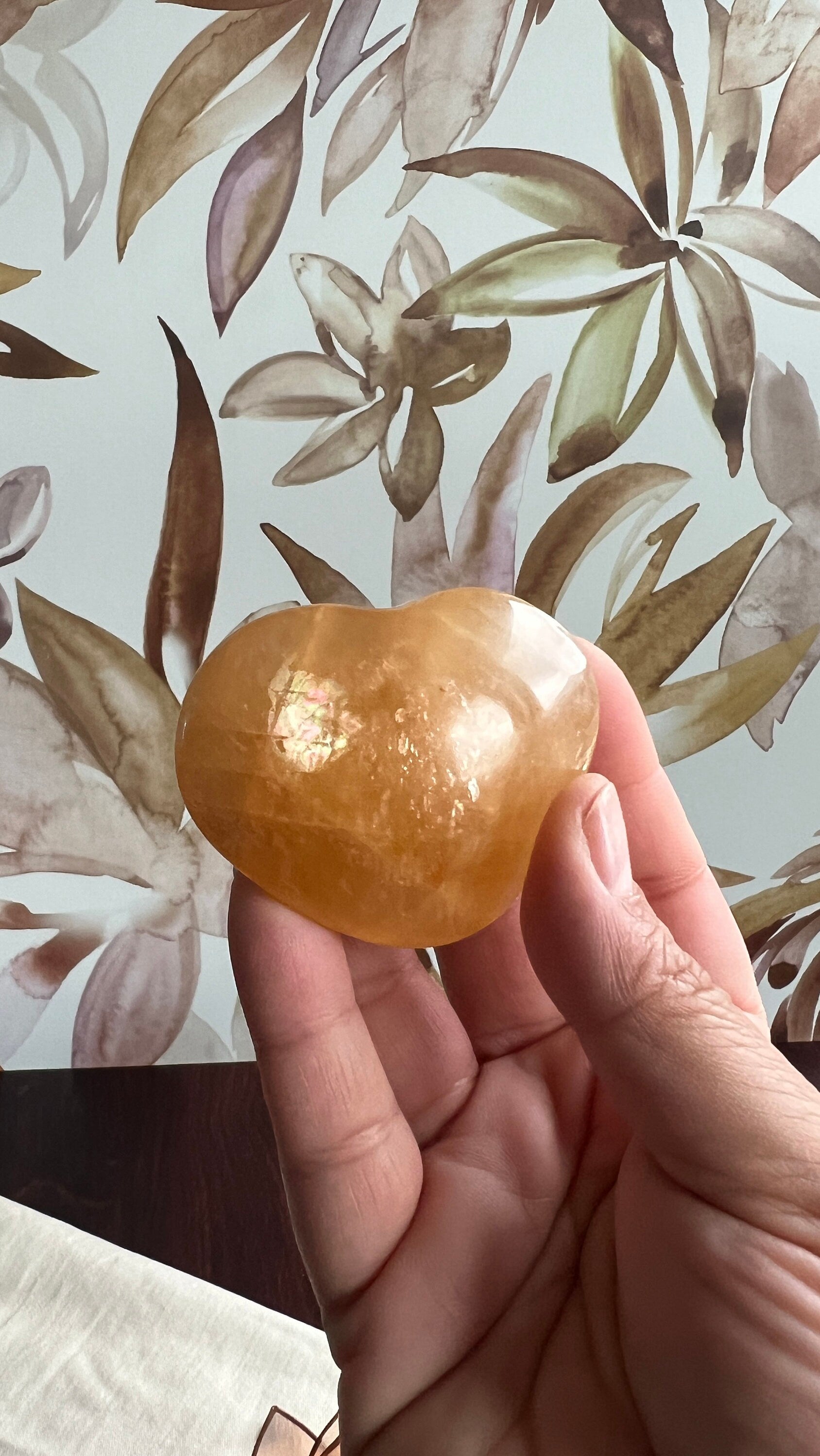 Beautiful Honey Calcite Heart Carving with rainbow inclusions 2 1/2 inches wide 3.5 ounces