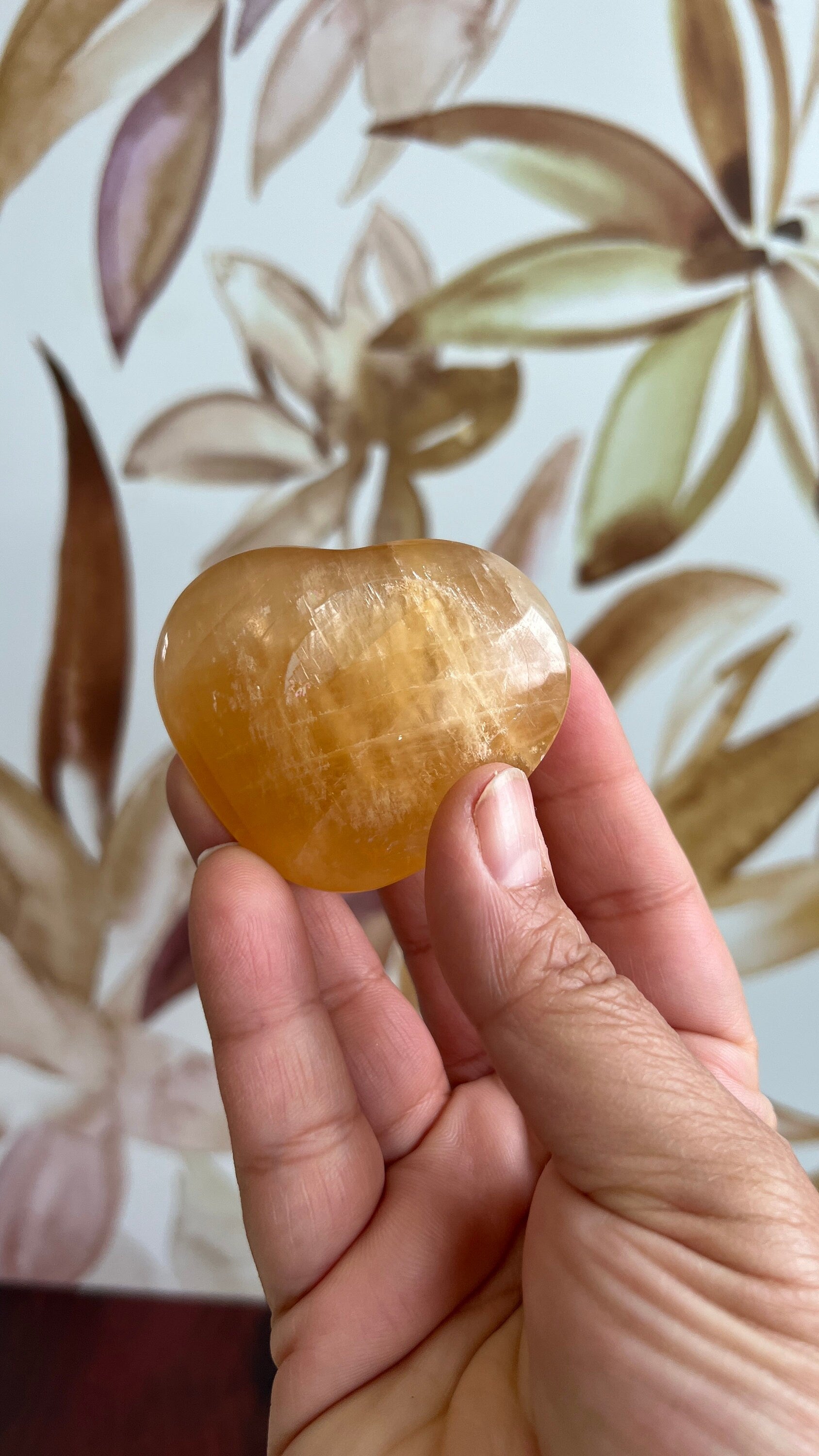 Beautiful Honey Calcite Heart Carving with rainbow inclusions 2 1/2 inches wide 3.5 ounces