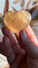 Load image into Gallery viewer, Beautiful Honey Calcite Heart Carving with rainbow inclusions 2 1/4 inches wide 2.8 ounces (HC-Heart2)
