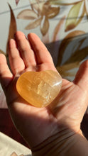Load image into Gallery viewer, Beautiful Honey Calcite Heart Carving with rainbow inclusions 2 1/4 inches wide 2.8 ounces (HC-Heart2)
