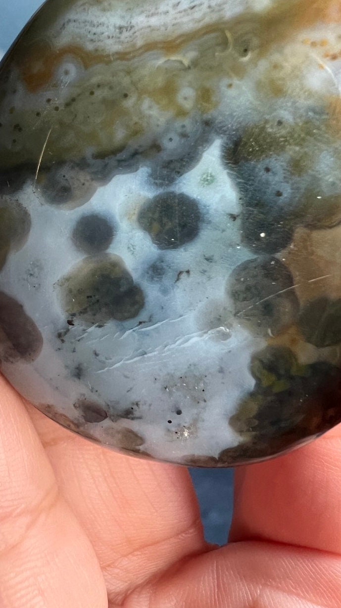 Incredible 8th Vein OJ (Ocean Jasper) Palm Stone with detailed fish eye orbs