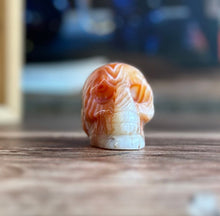 Load image into Gallery viewer, Carnelian Crystal Skull with Vibrant Banding | Banded Carnelian Agate Gemstone Skull | Unique Orange and White Halloween Decor (CarnSkull-1)
