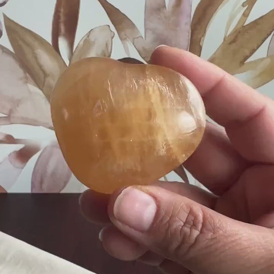 Beautiful Honey Calcite Heart Carving with rainbow inclusions 2 1/2 inches wide 3.5 ounces