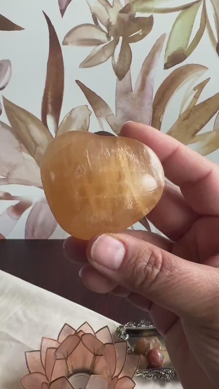 Beautiful Honey Calcite Heart Carving with rainbow inclusions 2 1/2 inches wide 3.5 ounces