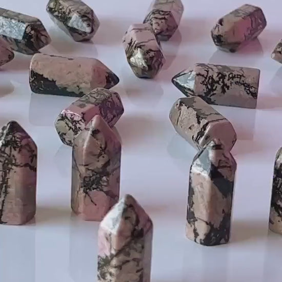 Colorful Rhodonite mini points 1 1/2 inch tall towers with a great pink color and black manganese throughout, Small pocket crystals