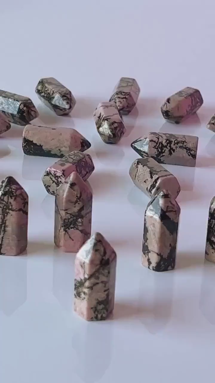 Colorful Rhodonite mini points 1 1/2 inch tall towers with a great pink color and black manganese throughout, Small pocket crystals