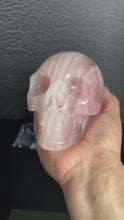 Load and play video in Gallery viewer, Beautiful Rose Quartz Skull. Approx 4 inches tall and 4 1/2 inches long.  Weighs 2.6 pounds
