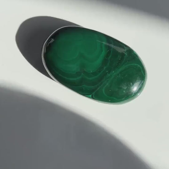 Authentic Malachite Palm Stones with wonderful patterns, High Quality and shine surface. No obvious blemishes. 2 inches 2.2 ounces