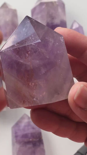 Beautiful 2 1/2 inch Amethyst Point with inclusions weighs 5 oz. Short but stocky tower with interesting subtle pattern