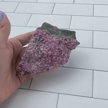 Load and play video in Gallery viewer, Pink Cobalto Calcite Raw Specimen on Matrix with a small amount of Malachite inclusion
