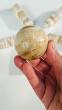 Load image into Gallery viewer, layered Agate Sphere ||  Creme and neutral color Crystal || Beautifully banded || Neutral aesthetic || 2&quot;   6.4 oz
