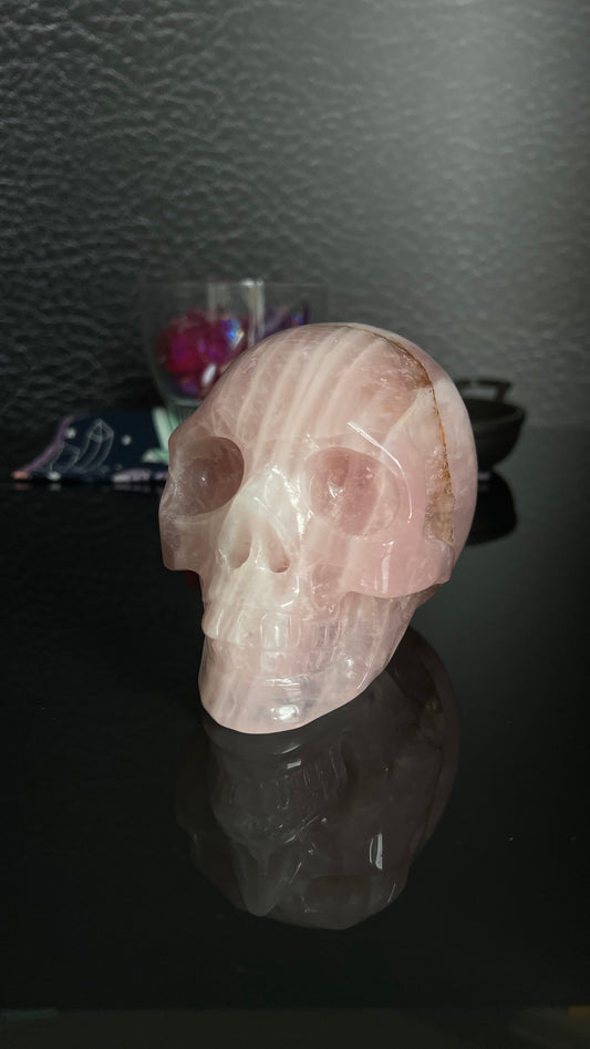 Beautiful Rose Quartz Skull. Approx 4 inches tall and 4 1/2 inches long. Weighs 2.6 pounds