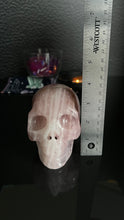 Load image into Gallery viewer, Beautiful Rose Quartz Skull. Approx 4 inches tall and 4 1/2 inches long. Weighs 2.6 pounds
